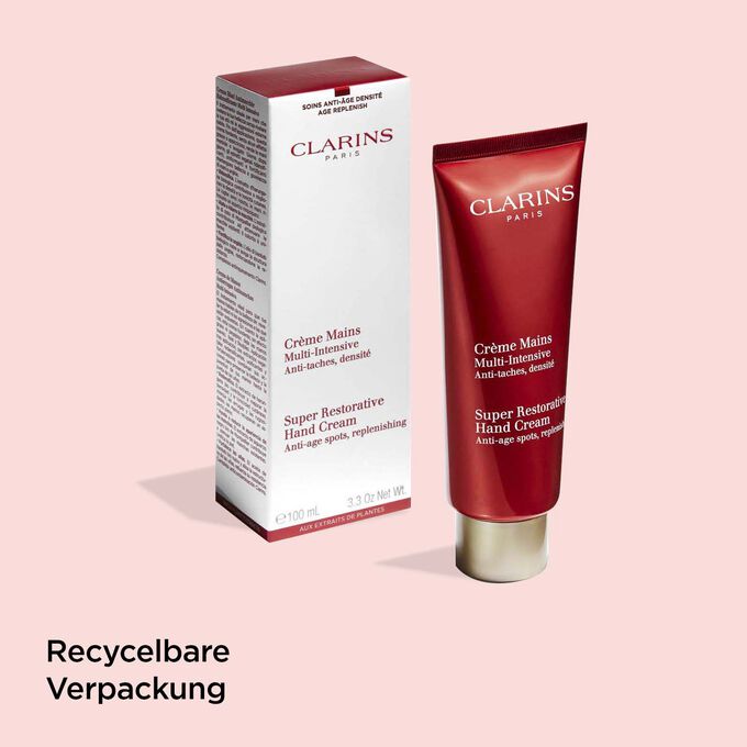 Tube der Multi-Intensive Handcreme von Clarins neben ihrer Verpackung, um die recyclingfähige Herkunft der Verpackung zu veranschaulichen.