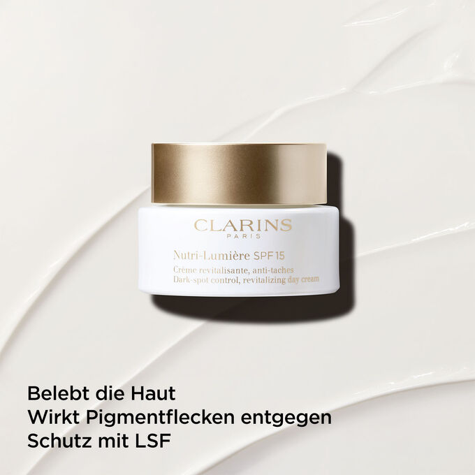 Anti-Pigmentflecken-Tagescreme mit LSF 15 vor einem strukturierten Hintergrund, um ihre belebende Wirkung für die Haut zu betonen.