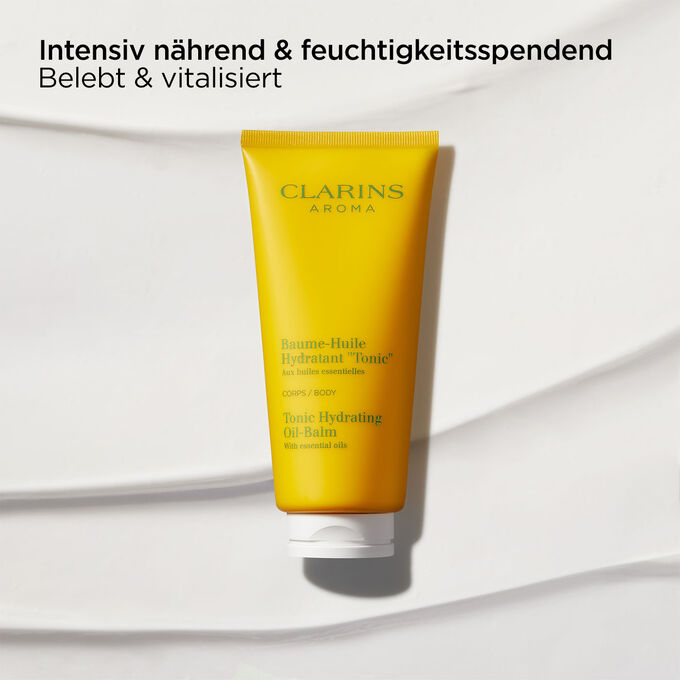Bild mit Clarins Baume-Huile Tonic Öl-Balsam, das seine nährenden, belebenden und feuchtigkeitsspendenden Eigenschaften betont.