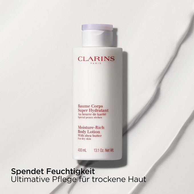 Packshot von Clarins Baume Corps Super Hydratant mit Text, der die nährende Wirkung des Produkts auf trockene Haut hervorhebt.