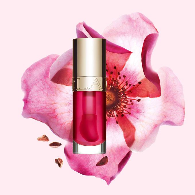 Huile Confort Lèvres 04 Pitaya aux bienfaits pour la peau, devant fleur de rosier rouillé illustrant ses ingrédients naturels