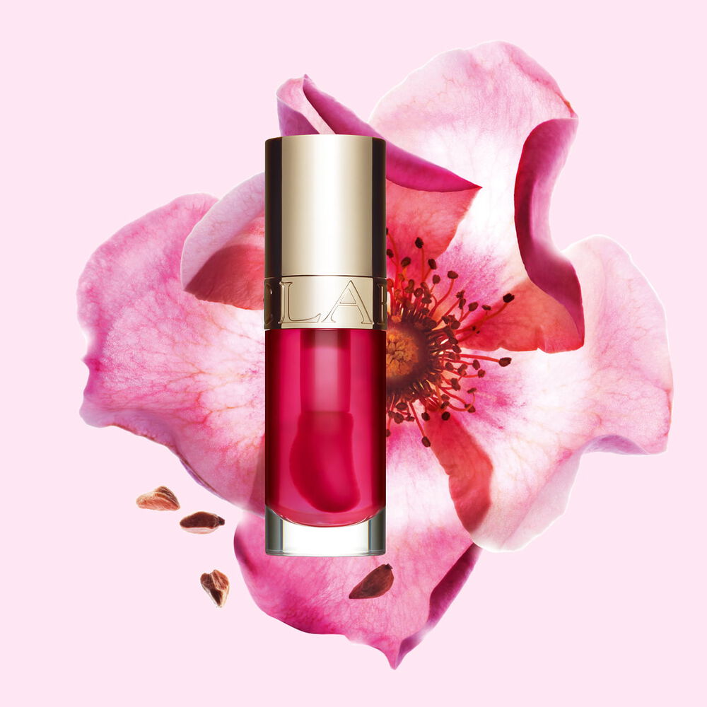 Huile Confort L&egrave;vres&nbsp;04 Pitaya aux bienfaits pour la peau, devant fleur de rosier rouill&eacute; illustrant ses ingr&eacute;dients naturels