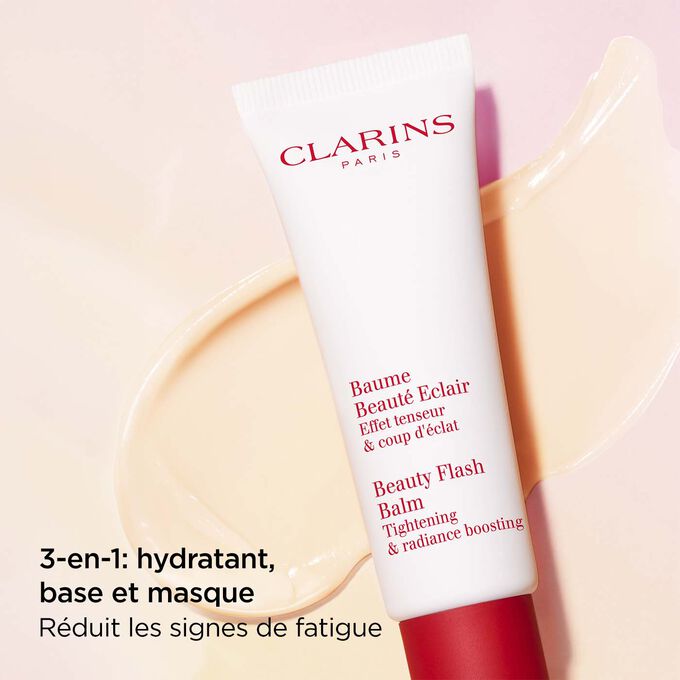 Plan produit du Baume Beauté Éclair Clarins sur fond texturé, avec son pouvoir nourrissant pour les peaux fatiguées.