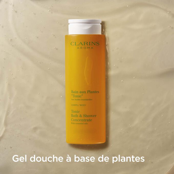 Plan produit du Bain aux Plantes "Tonic" de Clarins avec texte expliquant que c’est un gel douche parfumé à base de plantes.
