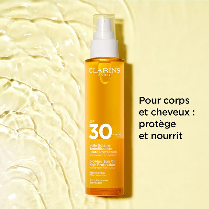 Plan produit sur fond textur&eacute; de l&rsquo;huile solaire en spray 30+ pour les cheveux et le corps avec du texte sur ses effets protecteurs et nourrissants