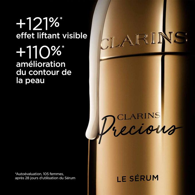 Plan produit du Sérum Clarins Precious sur fond noir, avec un texte sur son pouvoir liftant et le contour du visage amélioré.